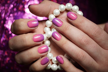 Beautiful bright natural nails with perfect clean manicure. Nail drill machine and cuticle nipper are used simultaneously to make such a clean manicure.