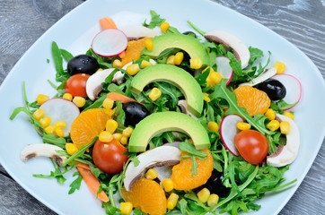 salad with avocado in dish on table