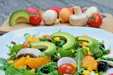 salad with avocado in dish on table