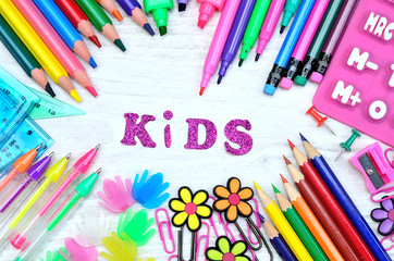 letter kids with color stuff on table