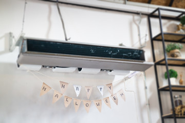 Hanging air conditioner and Halloween flags
