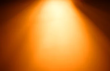 Selbstklebende Fototapete Licht und Schatten Oberer orangefarbener Lichtstrahl Bokeh-Hintergrund