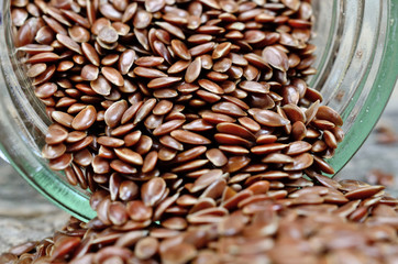 flaxseed in bowl flow on table