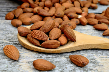 almond in spoon on table