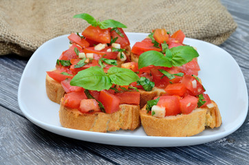 tomato bruschetta in white dish on  table