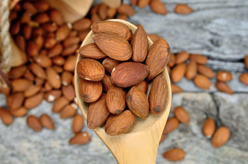 almond in spoon on table