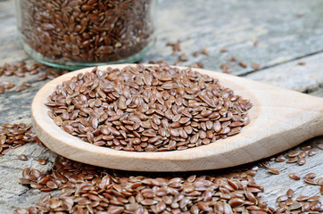 flaxseed in spoon on table