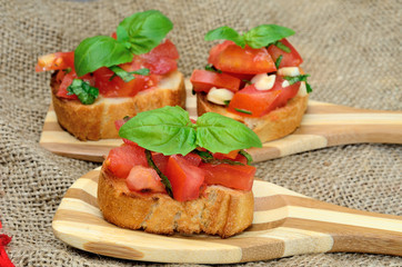 bruschette tomato in wooden spoon