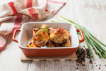 the baked chicken legs on a table, selective focus