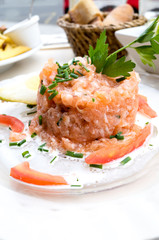 salmon and lemon - french cuisine dish with tomato and salmon