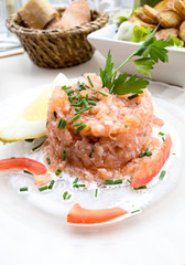 salmon and lemon - french cuisine dish with tomato and salmon