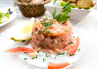 salmon and lemon - french cuisine dish with tomato and salmon