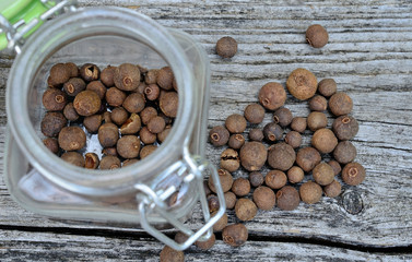 allspice in jar on table