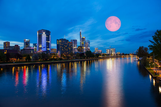 Skyline of Frankfurt am Main (Germany) at dusk with super moon "Elements of this image furnished by NASA"