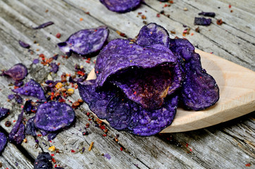 potato chips in spoon on table