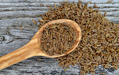 caraway in spoon on table