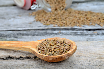 caraway in spoon on table