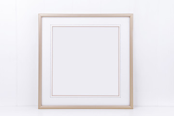 Mockup plain thin square gold frame on a white background overlay your quote promotion headline or...