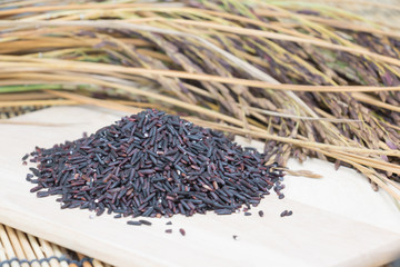 Thai Riceberry Rice on  wooden background