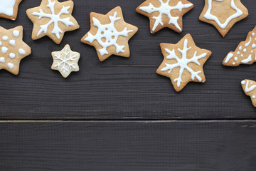 snowflakes in snowfall delicious Christmas/ patterned figured gingerbread cookies made by hand,...