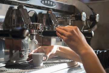 Making coffee on professional coffee machine