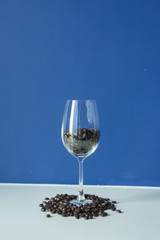 Roasted coffee bean in wine glass