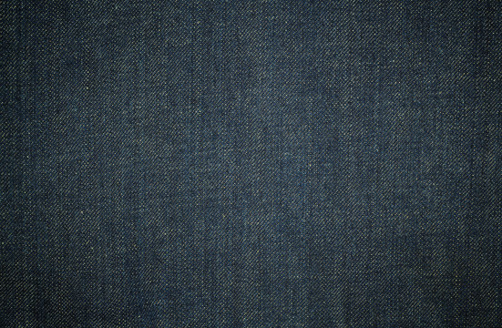 Texture of dark blue jeans background