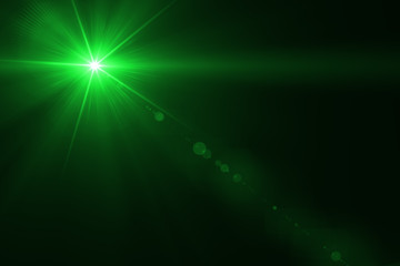 abstract lens flare green  light over black background