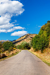 Tsaghkunyats mountain in Aghveran, Armenia. Beautiful road landscape with green mountains and magnificent cloudy sky