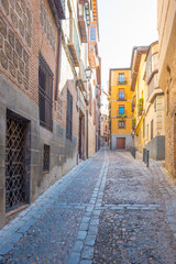 Fototapeta na wymiar Alley in the medieval city of Toledo 
