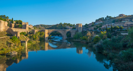 Fototapeta na wymiar Medieval bridge over a river in Toledo
