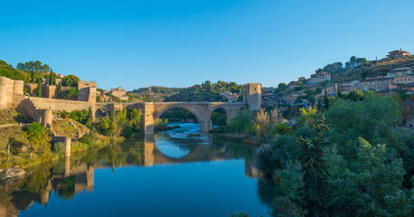 Fototapeta na wymiar Medieval bridge over a river in Toledo