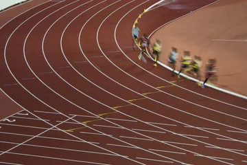 Gordijnen Group of professional athletes on the long distance track during athletic competition which is preparation on olympic game in Rio © kovop58