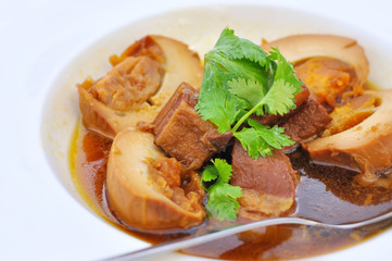 Eggs and stewed streaky pork with sweet brown sauce, fusion food concept and homemade idea
