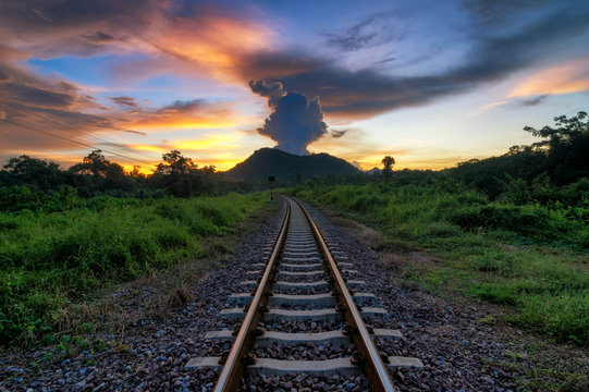Dramatic sunset over railroad.