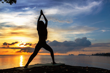 serenity and yoga practicing at sunset, meditation.Twilight in Thailand