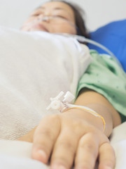 A patient is receiving medication via intravenous therapy
