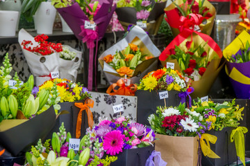 Fototapeta na wymiar flower market, Miscellaneous colored flowers on a market in pots