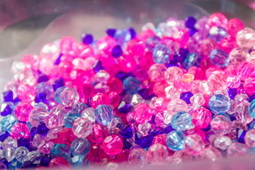 colorful background made of beads lit in the sun light