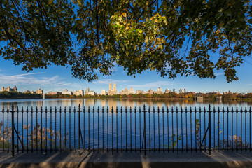 Fall in Central Park at the Jacqueline Kennedy Onassis Reservoir. Cityscape morning view with...