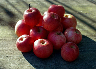 red apples on wooden background