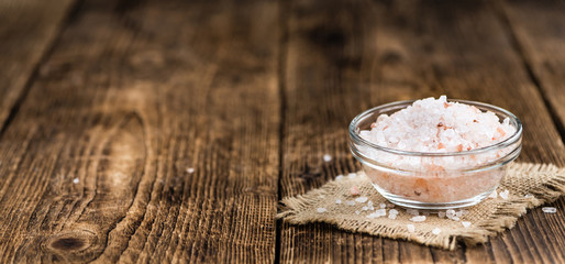 Wooden table with Pink Salt (selective focus)
