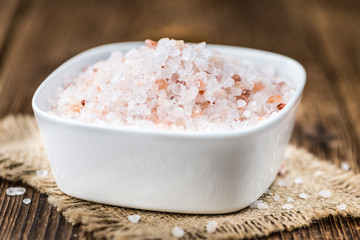 Wooden table with Pink Salt (selective focus)