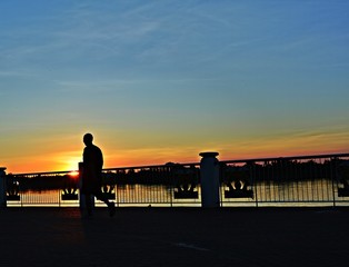 A man jogging in evening sunset background .