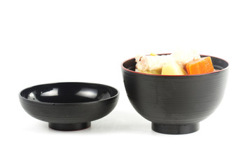 Chicken wings soup in wooden cup