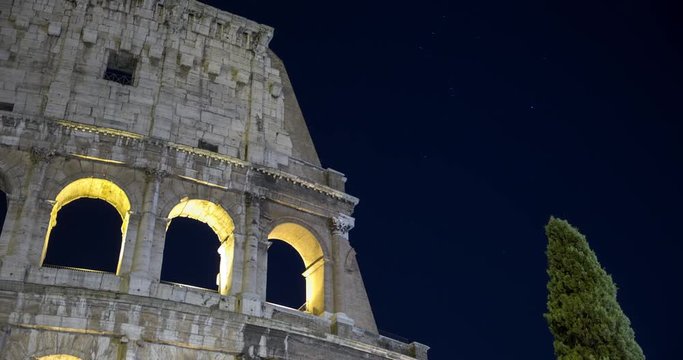 Rome, Italy - close-up of illuminated Colosseo at night - Timelapse with motion