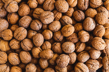 Whole walnuts background. Close up, top view.