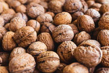 Whole walnuts background. Close up, top view.