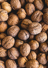 Whole walnuts background. Close up, top view.