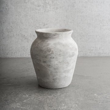 Old empty vase on stone table, still life. Concept of art, pottery object and vintage or antique decorative item.